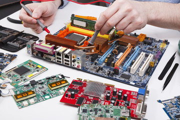 Poster - Engineer checking motherboard with multimeter
