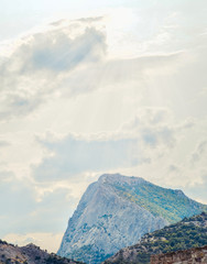 Wall Mural - beautiful landscape with green mountains and magnificent cloudy sky in sunset. exploring crimea, sud