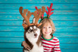 © Sunny studio - Happy child and dog on Christmas eve