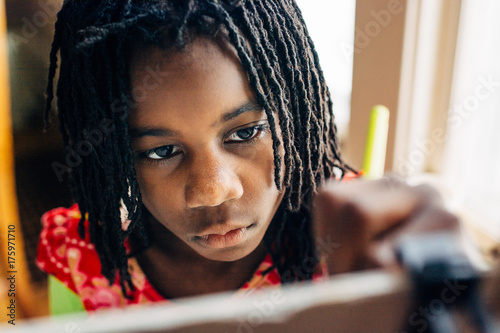 Black Girl Drawing With A Pencil Buy This Stock Photo And