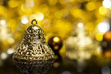 Wall Mural - Christmas decoration on a golden background. bokeh background and dark mirror floor.