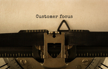 Poster - Text Customer focus typed on retro typewriter