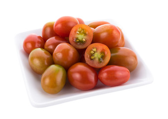 Wall Mural - tomato in white plate on white background