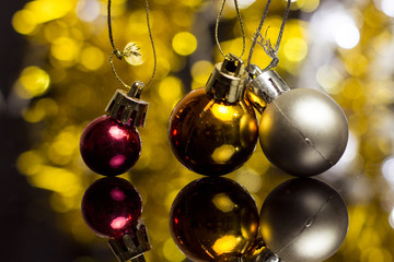 Wall Mural - Christmas decoration on a golden background. bokeh background and dark mirror floor.