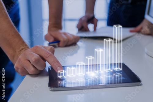 Cuadros en Lienzo Team analyzing 3D AR chart, tablet computer, growing chart, investment success