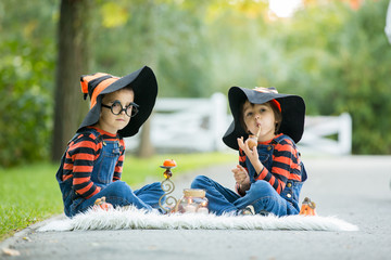 Wall Mural - Two boys in the park with Halloween costumes, having fun