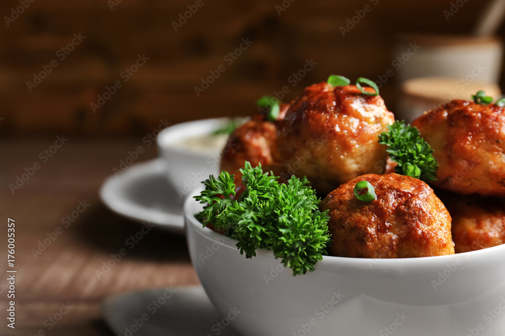 Bowl with delicious meatballs, closeup