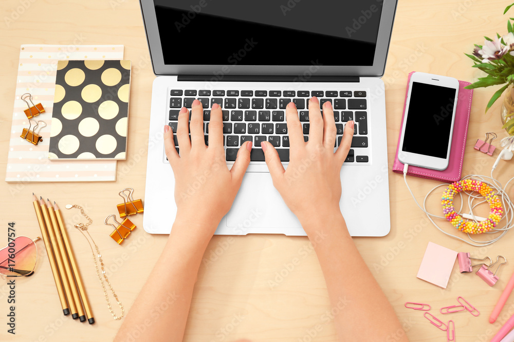 Woman working with laptop at table