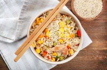 Sticker - Bowl with tasty brown rice on table