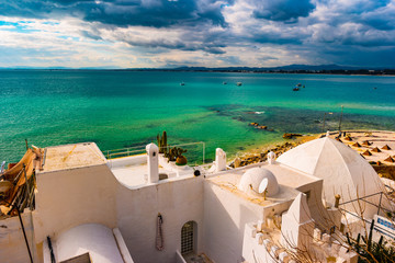 Wall Mural - Hammamet, Tunisia. Image of architecture of old medina with dramatic sky at sunset time.