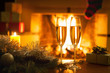 © Oleh - Two glasses in front of the fireplace. New Year. Christmas.