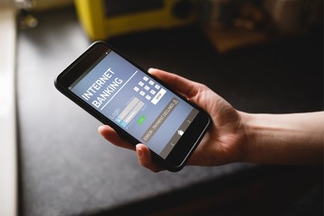 Poster - Composite image of internet banking text on blue mobile display