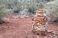Stone Cairn On A Montain Hiking Trail