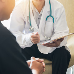 male patient having consultation with doctor or psychiatrist who working on diagnostic examination o