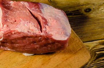 Raw pork meat on cutting board. Top view