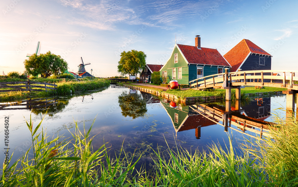 Traditional dutch windmill near the canal. Netherlands, Landcape at sunset - obrazy, fototapety, plakaty 