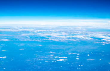Wall Mural - blue sky and cloud top view from airplane window,nature background