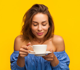 Young woman enjoying hot drink