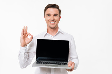 Wall Mural - Portrait of a cheerful positive man in white shirt