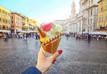 Italian Ice - Cream Cone Held In Hand On The Background Of Piazza Navona In Rome , Italy