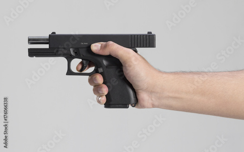 Zdjęcie XXL Mężczyzna ręka z pistoletem