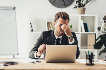 tired businessman at workplace