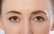  Woman Eyes. Middle aged female face portrait with healthy skin. Macro eyes and face.