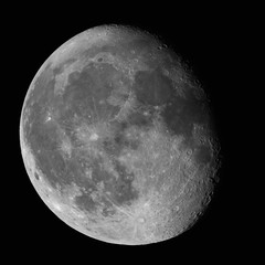 Wall Mural - moon waning gibbous 87% phase against black night sky high resolution image