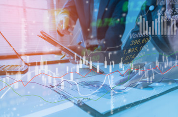 Business strategy invesment consept : Two businessman confident executive colleagues meeting and discussing at office with profit graph background.