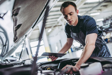 Wall Mural - Handsome auto service mechanic