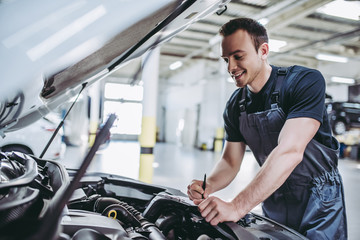 Handsome auto service mechanic