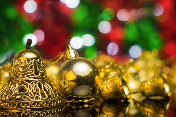 Wall Mural - Christmas decoration on a golden background. bokeh background and dark mirror floor.