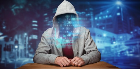 Poster - Composite image of robber sitting at table