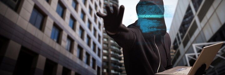 Poster - Composite image of hacker holding laptop while gesturing