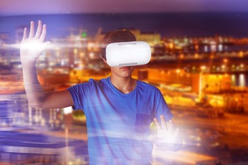 Poster - Composite image of boy using virtual reality simulator