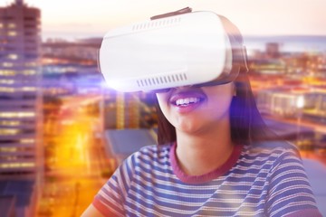 Poster - Composite image of happy woman looking through virtual reality