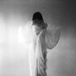 © Jacqui Miller/Stocksy - Woman wearing a long flowing dress with movement