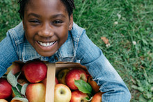 Smiling Black Girl With Apple Basket