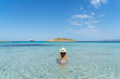 © ACALU Studio/Stocksy - Young woman in a paradise beach