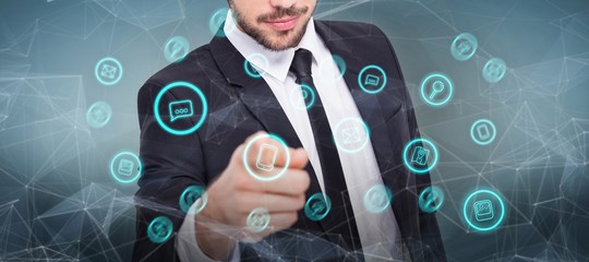 Poster - Composite image of smart businessman in suit pointing at camera