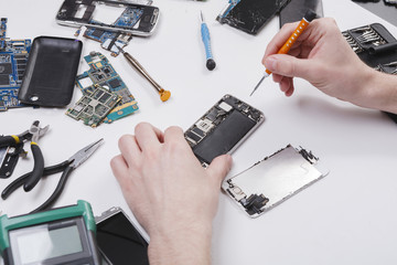 Poster - Repairman disassembling phone with screwdriver