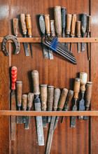 Old Carpenter Tools On A Wooden Wall