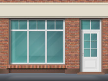 Store Front With Large Transparent Window. Facade Of Red Brick. Empty Glass Showcase Of Boutique. Entrance In The Small  Shop.