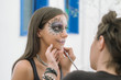 © Aleksandra Jankovic/Stocksy - Close up of a Young Woman with Skull Mask for Halloween