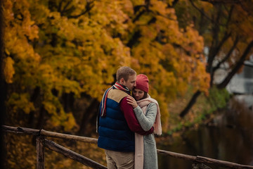 Wall Mural - Beautiful pair of lovers walking in the autumn Park