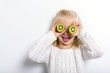 © Louis-Paul Photo - Cute girl 4-5 year old posing in studio with fruit kiwi