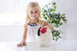 © Louis-Paul Photo - smiling little girl with piggy bank and money at home