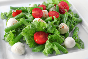 Plate of salad with green beans, closeup