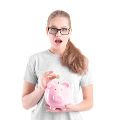 Sticker - Beautiful young woman with piggy bank on white background