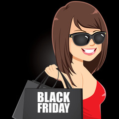 Canvas Print - Attractive woman with sunglasses holding black bags with Black Friday text on dark background